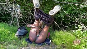 Ebony amateur masturbates in the woods