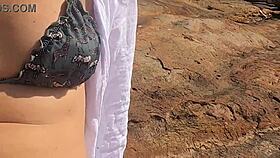 a beautiful young girl is WATCHED having sex in public on the beach rocks and INTERRUPTED by a third individual