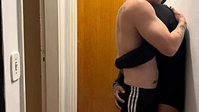 Young guys kissing get caught by the building camera – what a provocative scene!