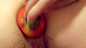 Watch this brunette fuck her hairy asshole with vegetables in the kitchen, gaping booty on display.