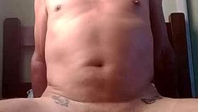 two men engage in intimate sexual activity together