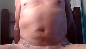 two men engage in intimate sexual activity together