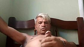 two men engage in intimate sexual activity together