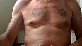 two men engage in intimate sexual activity together