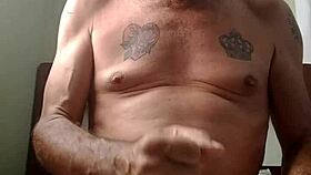 two men engage in intimate sexual activity together