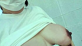 A frustrated bride masturbates openly in parking lot. Her breasts bounce wildly outdoors