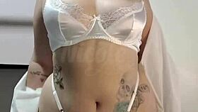 Teasing with sexy white lingerie on big tits