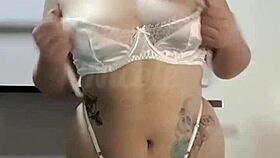 Teasing with sexy white lingerie on big tits