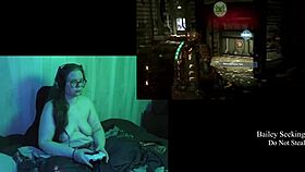 naked brunette plays deadspace part 2 with big natural tits
