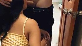 The seller sneaks behind the fitting room and shoves his big cock into the Arab babe's pussy in the clothes store.