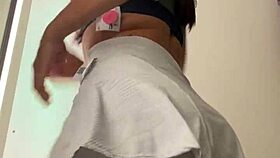 Wife changes clothes in mall fitting room