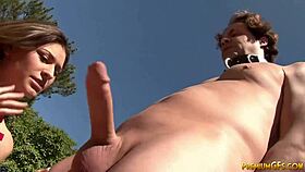 This teen dominates with a rough handjob on a mature cock outdoors.