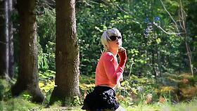 Shemale teen uses toys for oral pleasure in the forest