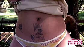 Nina, a latina teen, teases outdoors by showing her natural tits and rubbing her clit while masturbating.