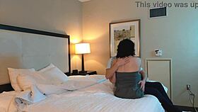 romantic couple shares a gentle makeout session with tattoos visible