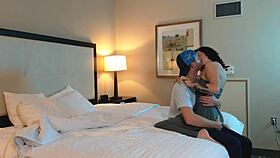 romantic couple shares a gentle makeout session with tattoos visible