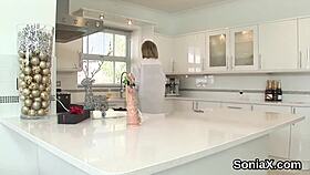 British mature Gill Ellis flaunts her enormous melons in wedding lingerie. She teases the camera seductively.