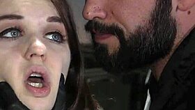 Officer disciplines busty gagged slave at work in rough submission.