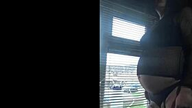 bisexual crossdresser milks publicly by the window in homemade setting