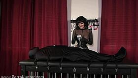 hey, check out this bound slave in a catsuit getting shocked by her femdom mistress 😈