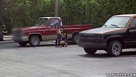 Latina amateur sucks big cock in outdoor parking lot passionately.