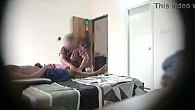 In the hotel, he flashes his cock to two maids during a massage session