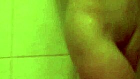 Blonde beauty in shower masturbates intensely and quietly reaches climax