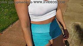 Curvy babe shows off in public. She flashes tits while walking city streets.