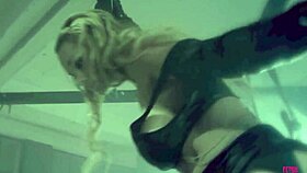 blonde sucking the dick of a tied up guy in bdsm mask