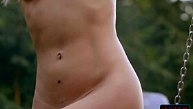 Amazing ass Russian blonde Zhenya Belaya is stripping outdoor in the woods, what a sight!