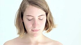 Young babe intensely blows and pops her first balloon