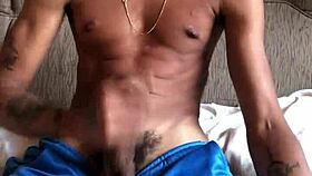 Mature amateur masturbates big cock in soccer shorts, cumming to finish.