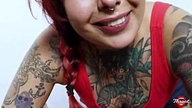 Alternative redhead Lizzy Hartz gives a hot blowjob and anal sex