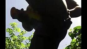 Flexible ebony shows off legs in outdoor gym session