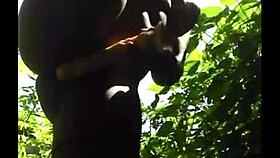 Flexible ebony shows off legs in outdoor gym session