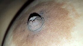 BBW squeezes her big nipples hard.