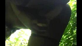 Flexible ebony shows off legs in outdoor gym session