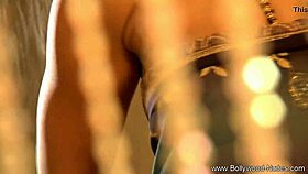 a bollywood actress UNDRESSING and DANCING in a striptease, clothes RIPPED