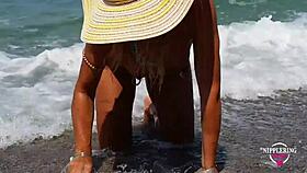 nippleringlover shows off extreme stretched nipple piercings and multiple pussy rings at nude beach