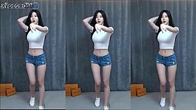 Korean cutie dances sensually with big tits on a magic phone display