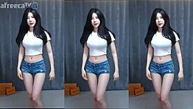 Korean cutie dances sensually with big tits on a magic phone display