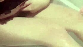 In the bathroom, the naughty sister watches porn and uses a dildo to masturbate to orgasm.