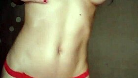 Latina wife performs a red striptease for her lover in lingerie