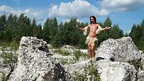 She dances topless in the quarry.