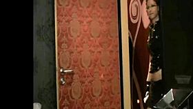 German dominatrix teases with dildo in tight pussy in fetish uniform