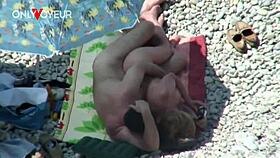 Beach voyeur catches mature couple banging under bright sun