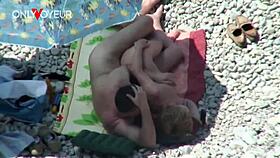 Beach voyeur catches mature couple banging under bright sun