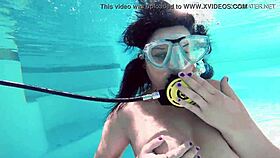 Brita piskova masturbates her tight pussy underwater in the pool