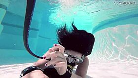 Brita piskova masturbates her tight pussy underwater in the pool
