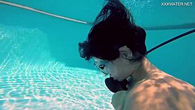 Brita piskova masturbates her tight pussy underwater in the pool